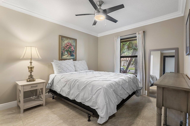 bedroom with crown molding, baseboards, and ceiling fan