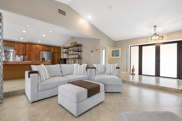 living area featuring high vaulted ceiling, light tile patterned flooring, recessed lighting, visible vents, and french doors