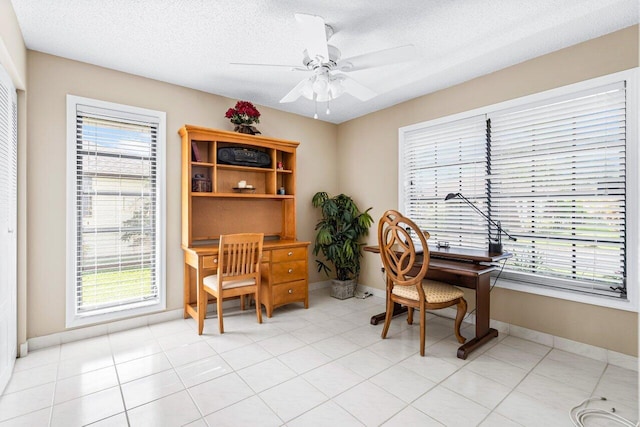 office featuring ceiling fan, a textured ceiling, and light tile patterned floors