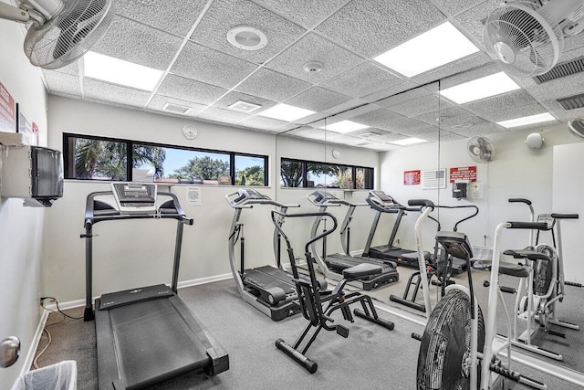 exercise room with a paneled ceiling