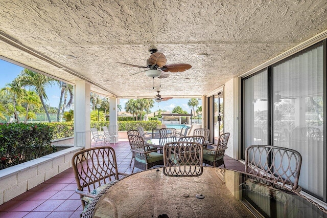 sunroom / solarium with ceiling fan