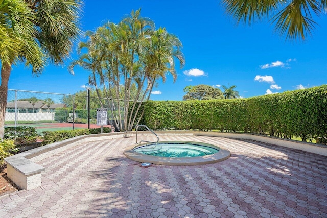 view of swimming pool featuring a community hot tub