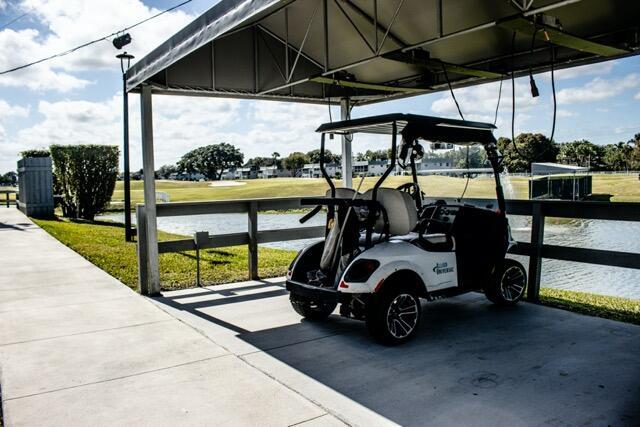 view of vehicle parking with a water view