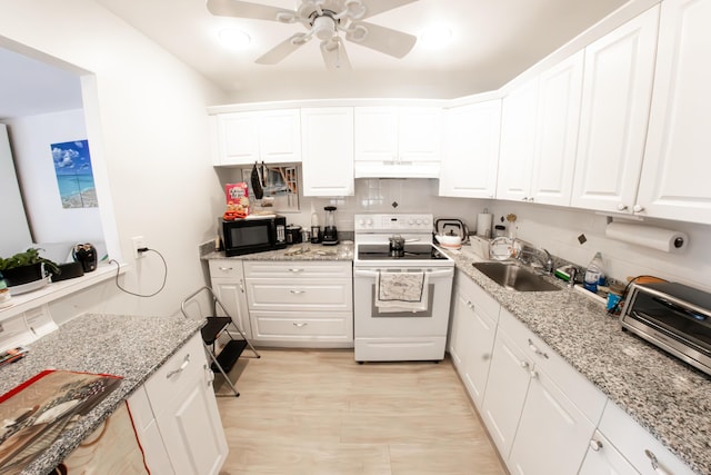 kitchen with electric stove, sink, white cabinetry, and light stone countertops