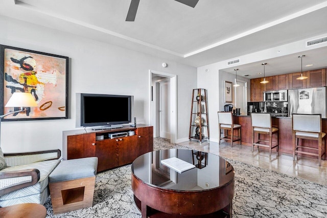 living room featuring ceiling fan