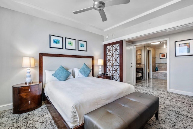 bedroom with ceiling fan and ensuite bath