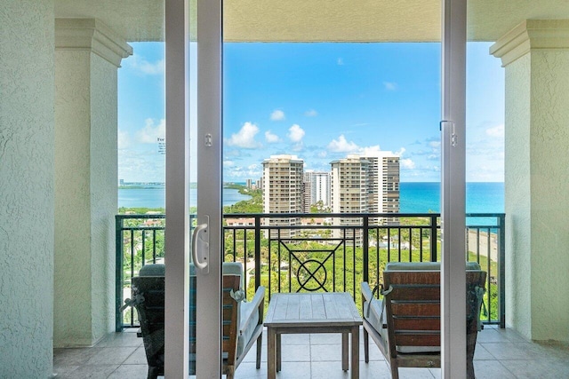 balcony featuring a water view