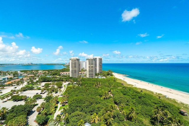 bird's eye view featuring a view of the beach and a water view