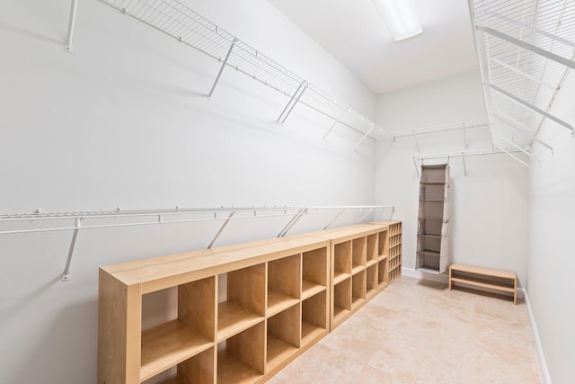 walk in closet featuring tile patterned flooring