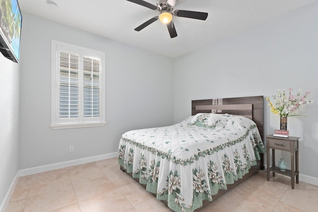 tiled bedroom featuring multiple windows and ceiling fan