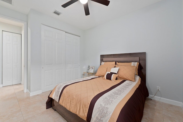 tiled bedroom featuring a closet and ceiling fan