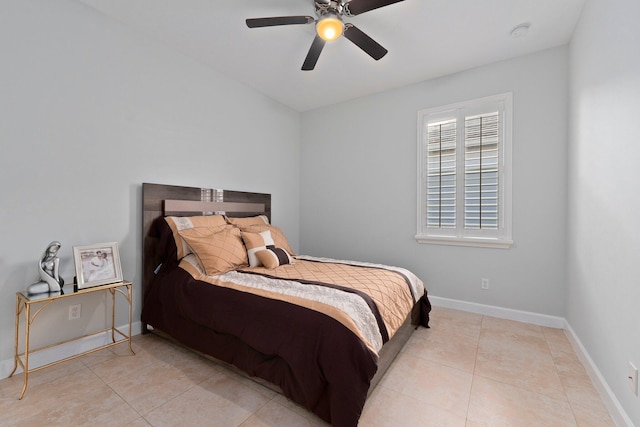 tiled bedroom featuring ceiling fan