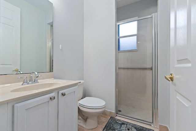 bathroom with tile patterned flooring, walk in shower, vanity, and toilet