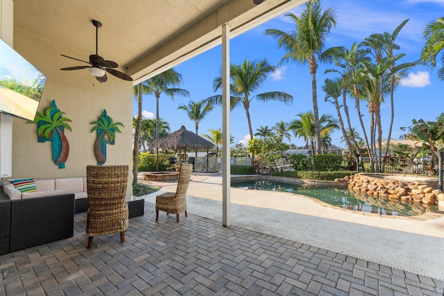 view of patio / terrace featuring a gazebo, outdoor lounge area, and a fenced in pool