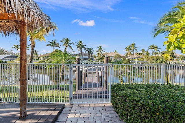 view of gate with a water view