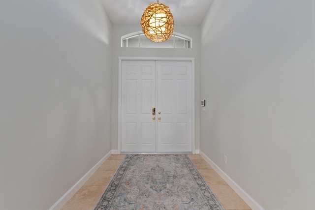 entryway with light tile patterned flooring