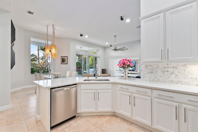 kitchen featuring ceiling fan, stainless steel dishwasher, and white cabinets