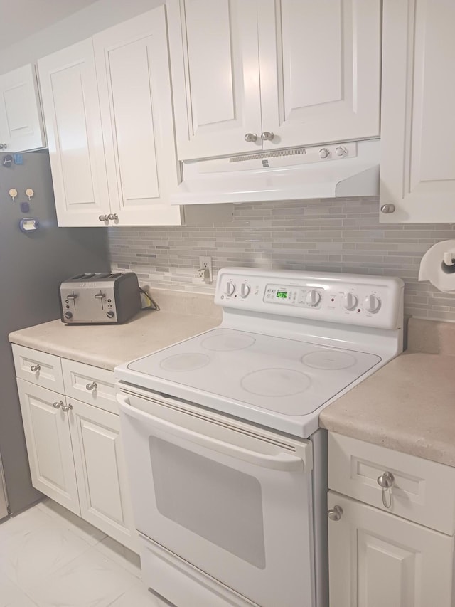 laundry area with marble finish floor, a toaster, and laundry area