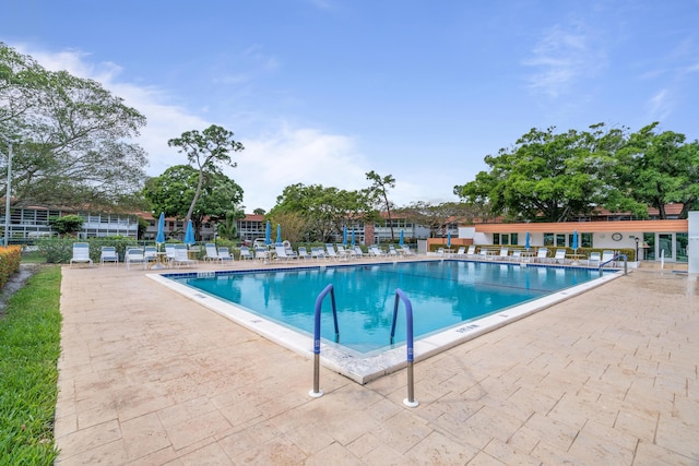 view of swimming pool with a patio area