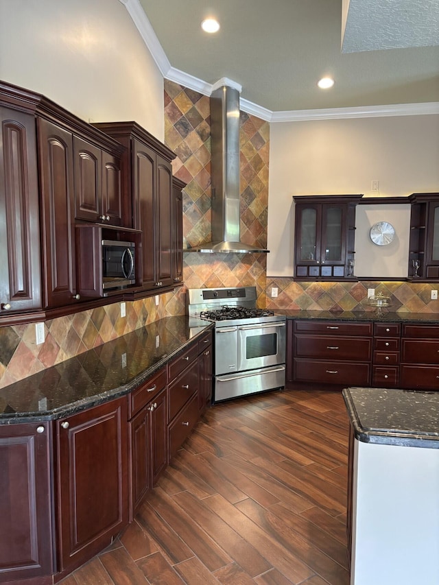14717 11th Ter, Loxahatchee Groves, FL 33470 - kitchen featuring range with two ovens, wall chimney exhaust hood, ornamental molding, glass insert cabinets, and dark wood finished floors