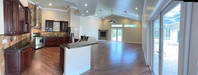 14717 11th Ter, Loxahatchee Groves, FL 33470 - kitchen with stainless steel appliances, ornamental molding, ceiling fan, dark wood-type flooring, and a fireplace