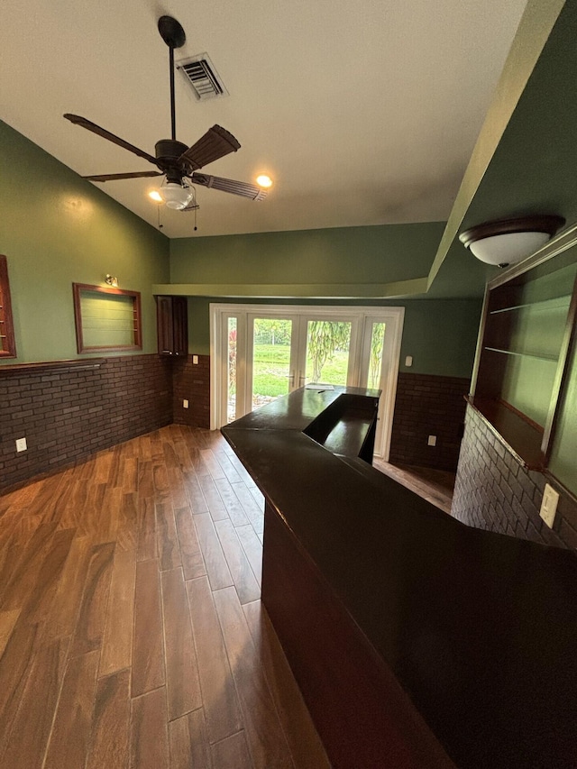14717 11th Ter, Loxahatchee Groves, FL 33470 - corridor featuring brick wall, wood finished floors, and wainscoting