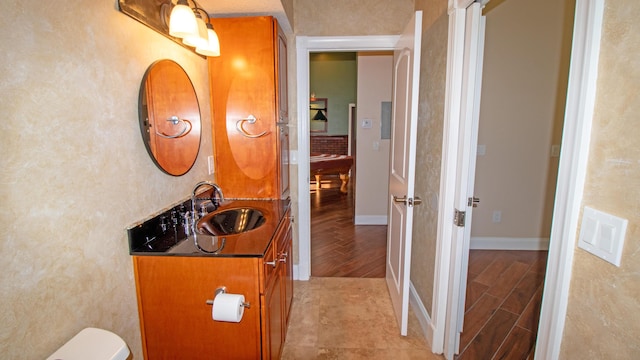 bathroom with hardwood / wood-style floors and vanity