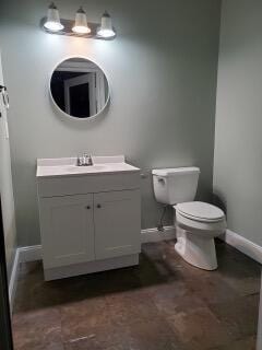 14717 11th Ter, Loxahatchee Groves, FL 33470 - bathroom featuring vanity, baseboards, and toilet