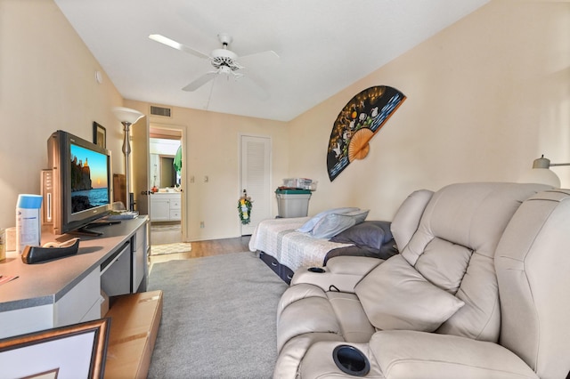 living room with ceiling fan and hardwood / wood-style floors