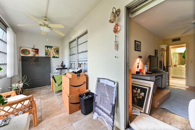 interior space featuring ceiling fan