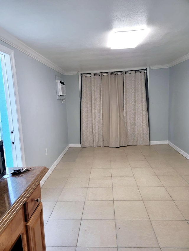 interior space with crown molding and an AC wall unit