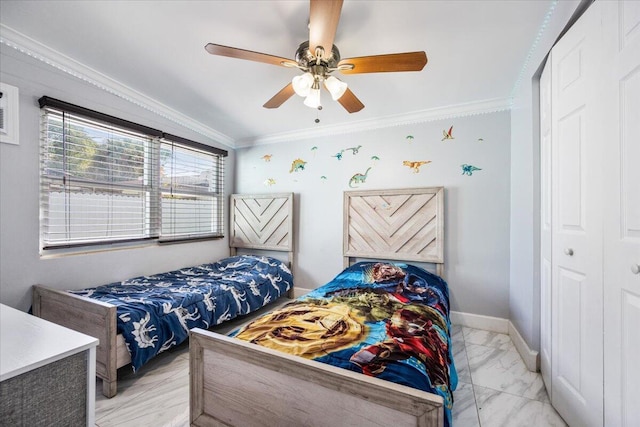 bedroom featuring crown molding, ceiling fan, and a closet