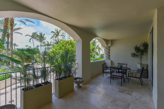 view of patio with a balcony