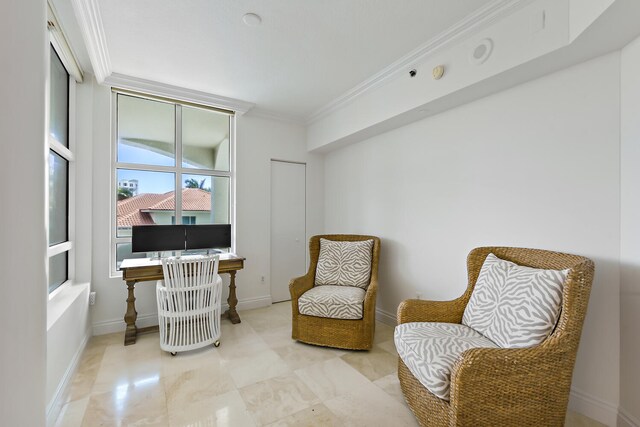 sitting room with ornamental molding