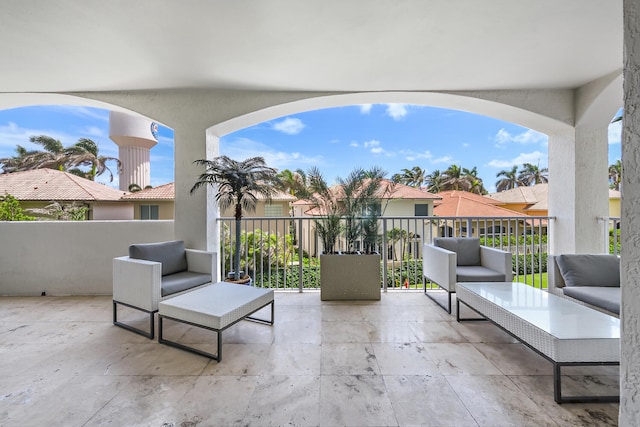 view of patio featuring a balcony and an outdoor hangout area