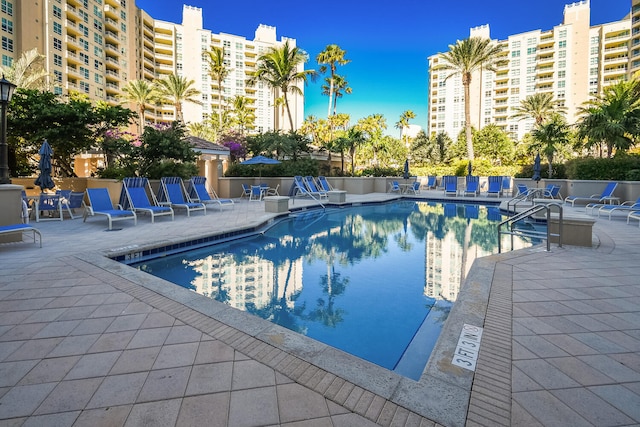 view of swimming pool featuring a patio area