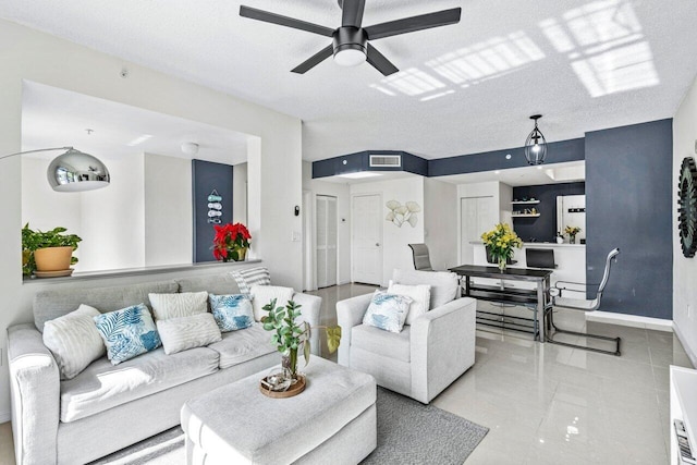 tiled living room with ceiling fan