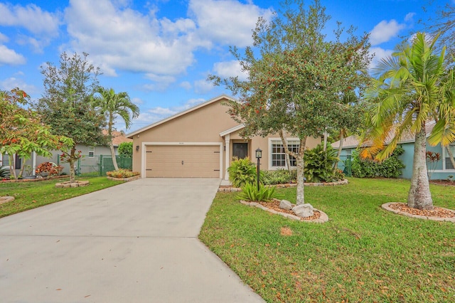 view of front of property with a garage and a front yard