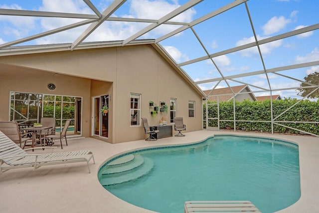 view of pool with a lanai and a patio area