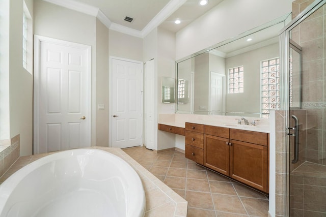 bathroom with tile patterned floors, ornamental molding, plus walk in shower, and vanity