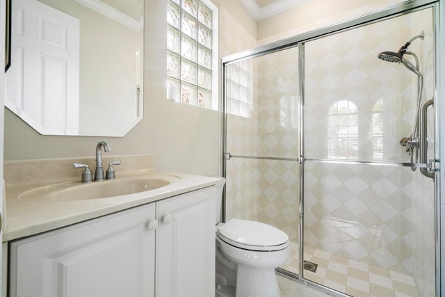 bathroom featuring vanity, an enclosed shower, crown molding, and toilet