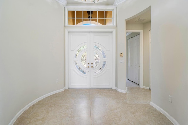 tiled foyer entrance with french doors