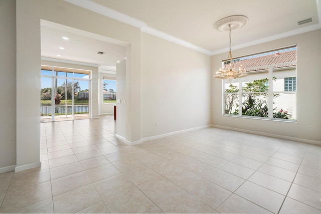 tiled empty room featuring crown molding and an inviting chandelier