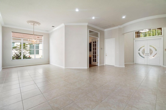 unfurnished room featuring light tile patterned flooring, ornamental molding, and a chandelier