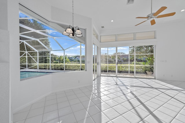 unfurnished sunroom featuring a wealth of natural light and ceiling fan