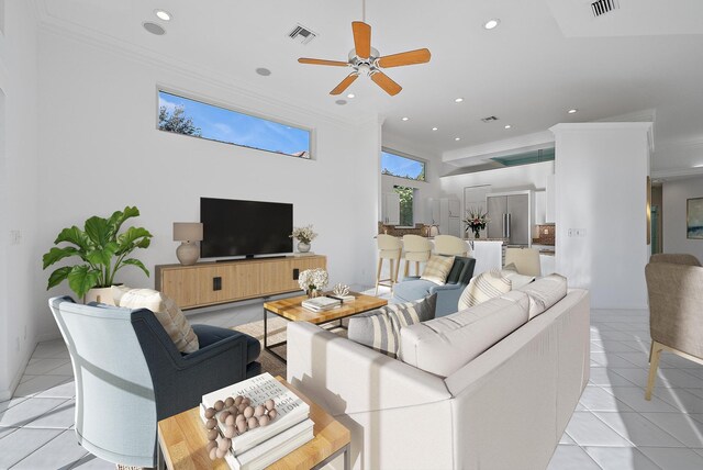 kitchen featuring white cabinetry, crown molding, light stone counters, a center island, and high quality fridge