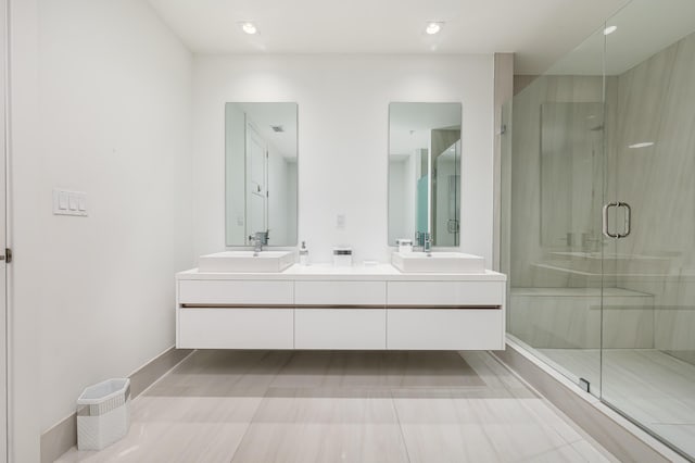 bathroom with walk in shower and vanity