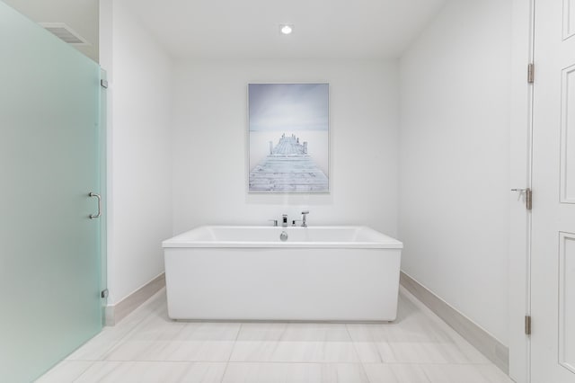 bathroom featuring a washtub