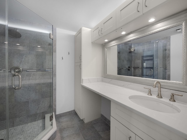 bathroom with vanity and walk in shower