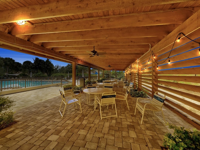 view of patio / terrace featuring a community pool and ceiling fan